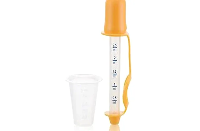 Infant and children's Tylenol acetaminophen with a dosing syringe and cup for dosing by weight