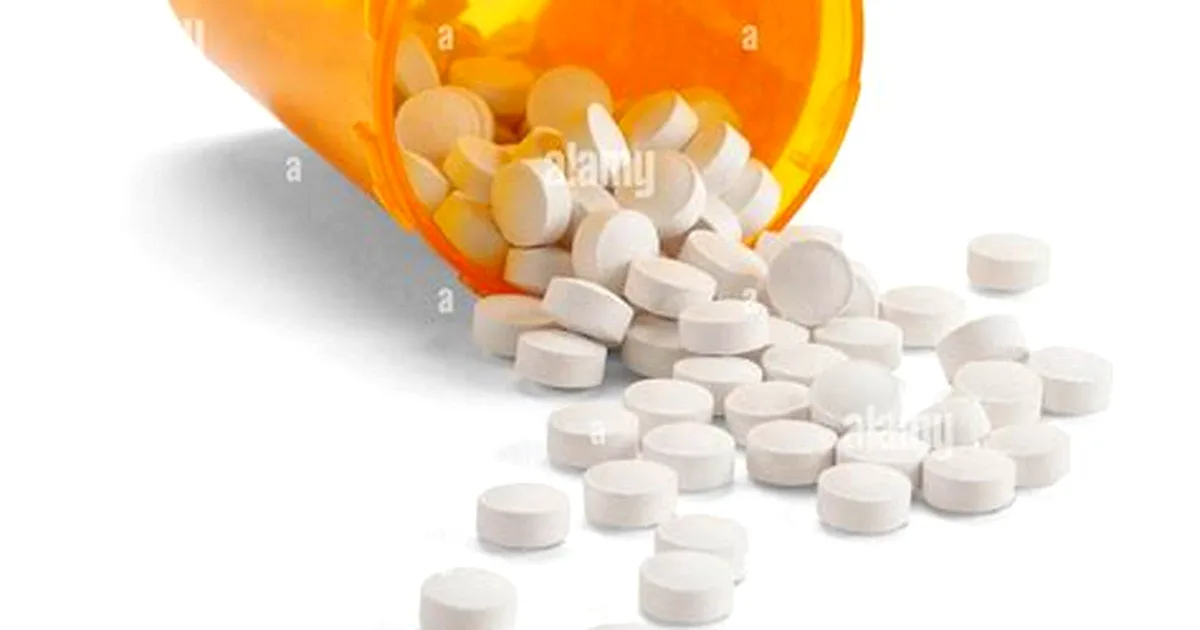 A bottle of Tylenol Extra Strength 500 mg acetaminophen caplets on a countertop